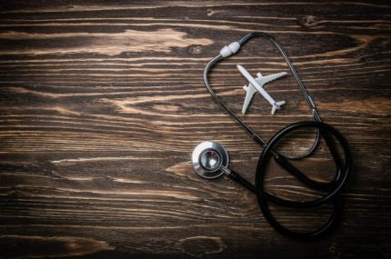Medical tourism concept - stethoscope, airplane