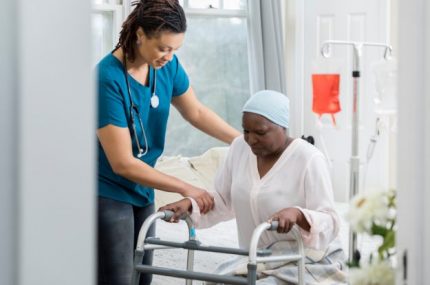 Home healthcare provider helps a senior woman